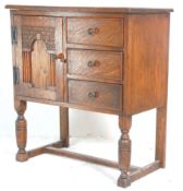 A 1930's early 20th Century oak bed side cupboard having a carved brick arch design panel to the