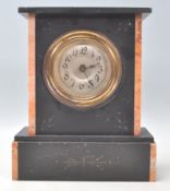 An early 20th Century slate and marble mantel clock having a silvered dial with Arabic numeral