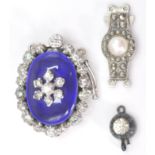 A collection of vintage silver and enamel set clasps to include Victorian single stone, larger