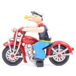 CAST IRON FIGURINE OF POPEYE ON HIS MOTORCYCLE