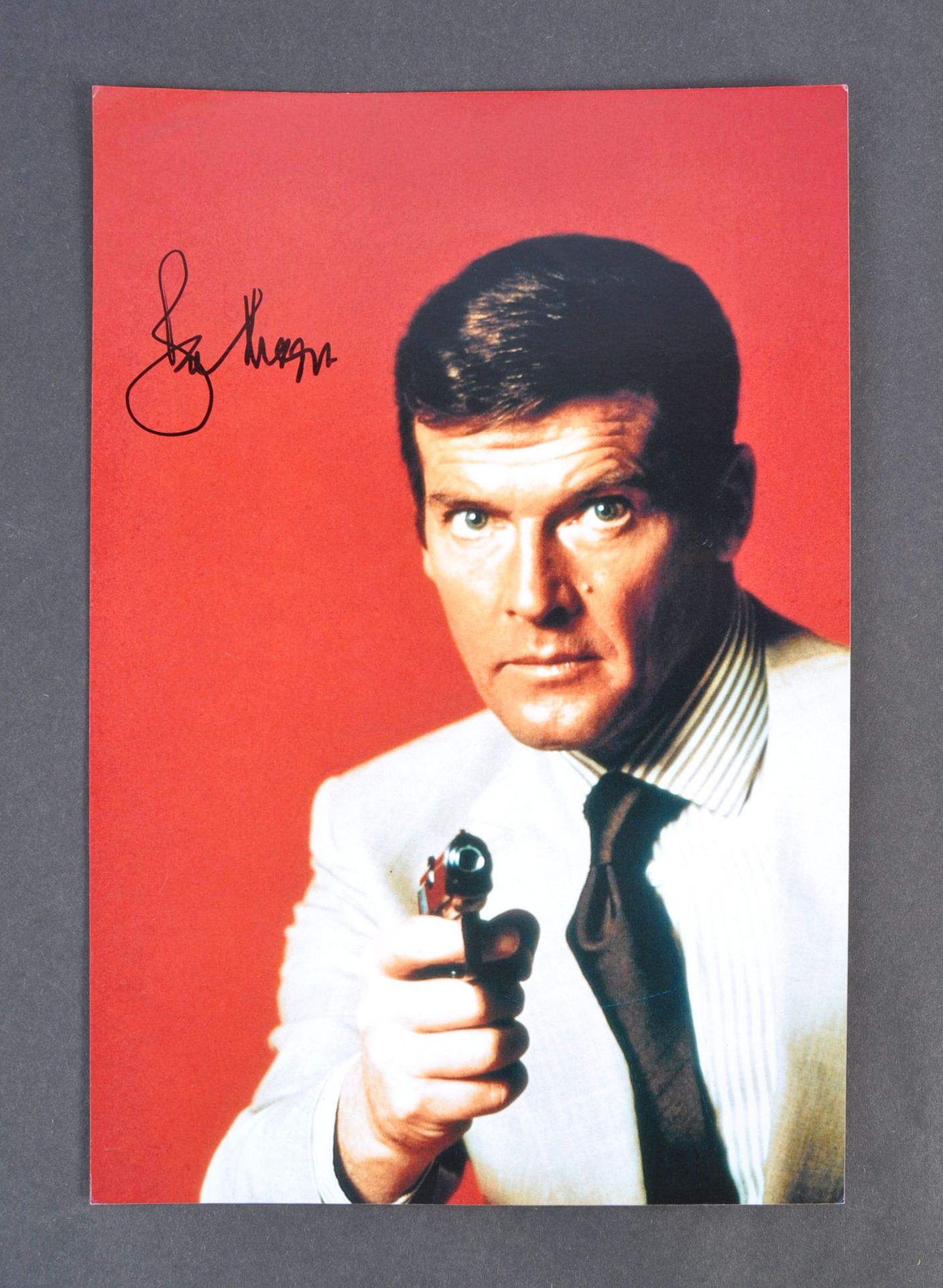 ROGER MOORE - JAMES BOND 007 - SIGNED 8X12" PHOTOG