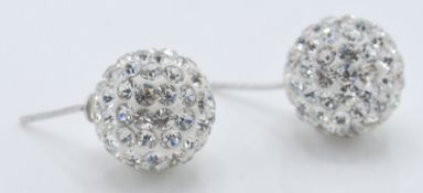 A pair of stamped 925 silver ball earrings being s