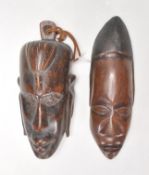 Two carved wooden African tribal wall hanging mask