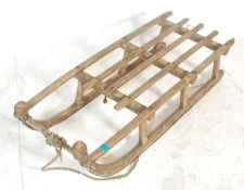 A vintage 20th Century wooden framed sleigh / sled