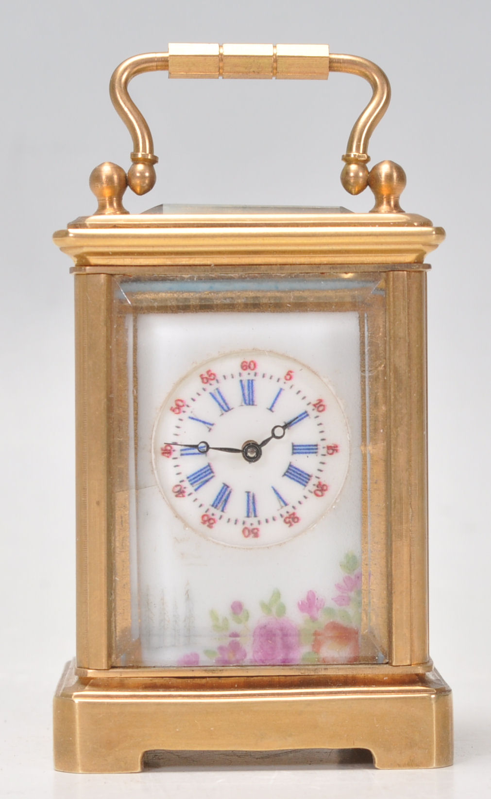 A vintage brass cased miniature carriage clock hav