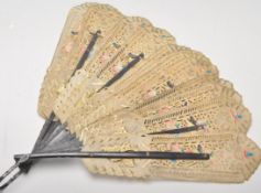 An early 20th century hand fan having ebonised rib