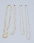 A collection of 4 cultured pearl necklaces. Three