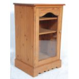 A contemporary antique style country pine cupboard