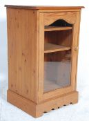 A contemporary antique style country pine cupboard