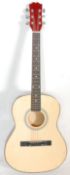 A vintage six string acoustic guitar having an inl