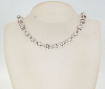 A Links Of London style silver necklace having rou