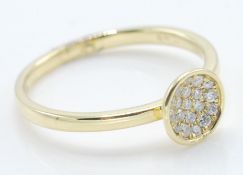 An 18ct gold ring having a round head set with a c