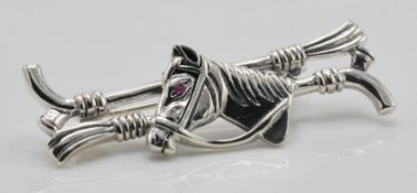 A stamped 925 silver equestrian brooch in the form