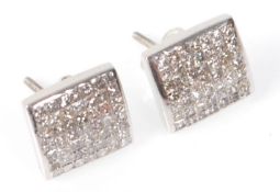 A pair of 14ct white gold ladies earrings having s