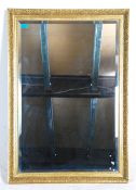 A 20th Century antique style wall mirror of rectan