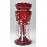 A 19th Century Victorian cranberry glass mantle pi