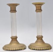 A pair of 19th Century antique brass candlestick h