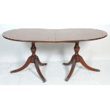 An antique mahogany folding breakfast table having