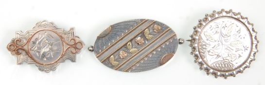 A group of three Victorian silver brooches having