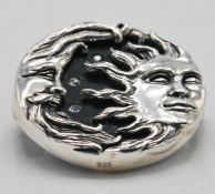 A stamped 925 silver brooch in the form of the sun