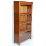 EARLY 20TH CENTURY UPRIGHT 4 SECTION LAWYERS STACKING BOOKCASE