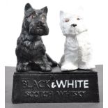 CAST IRON BUCHANAN'S BLACK AND WHITE SCOTCH WHISKY ORNAMENT