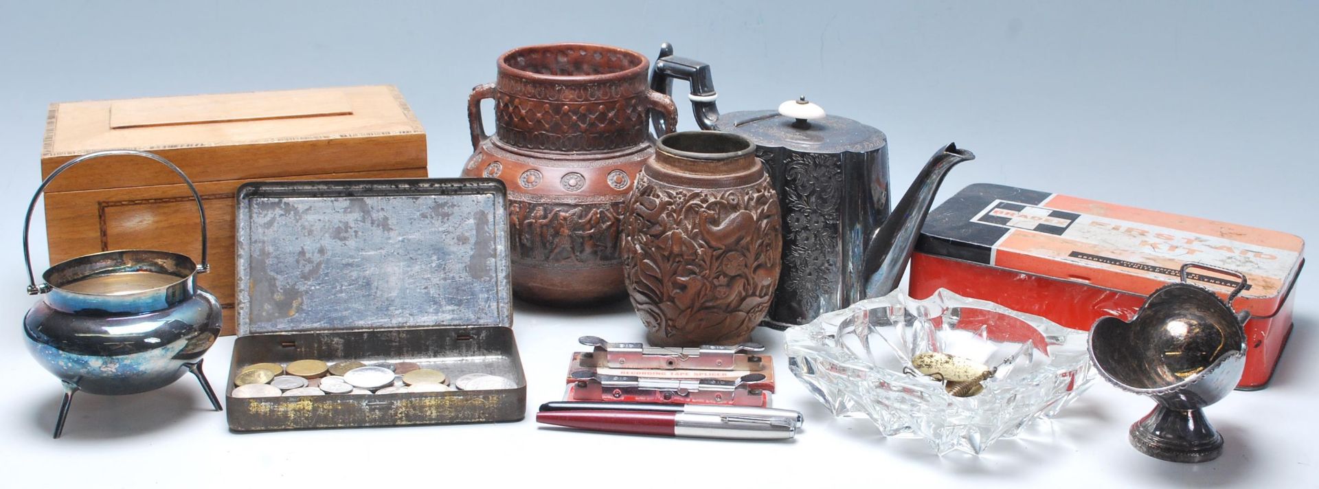 A collection of vintage curiosity items to include Parker pens, wooden carved brush pot, fire aid