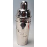 A large silver plated cocktail shaker of tapering form with a rotating outer vessel. The inner