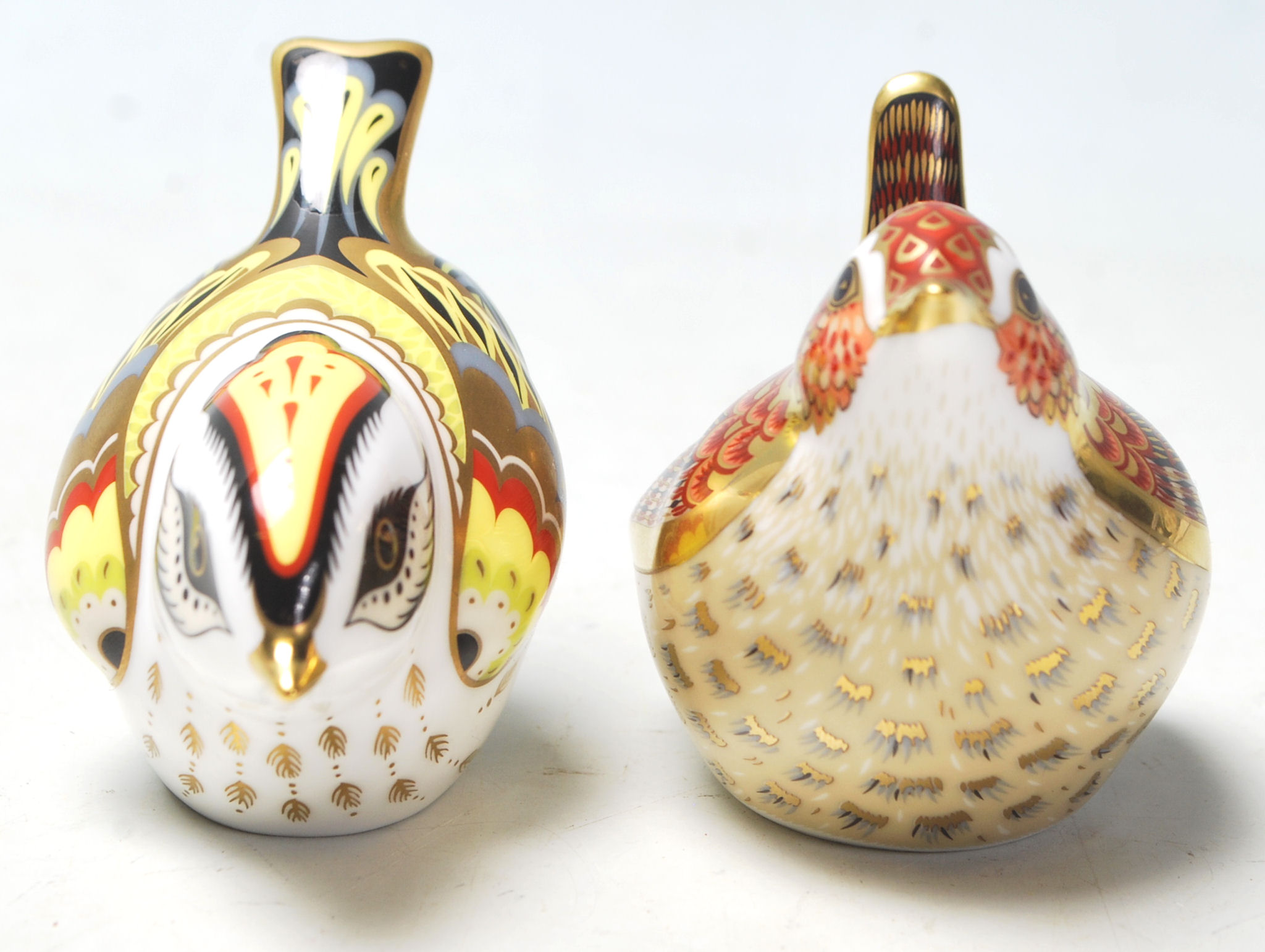 A pair of Royal Crown Derby paperweights both in the form of birds including Jenny Wren and both