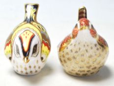 A pair of Royal Crown Derby paperweights both in the form of birds including Jenny Wren and both