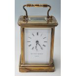 A 20th Century brass carriage clock by Matthew Norman of London having with a roman numeral