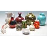 A collection of retro 20th Century studio art Poole pottery to include ceramic green glazed vase