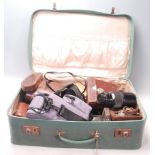 A collection of retro vintage cameras and accessories to include a Nikon FM 2, Nikon Series E lens