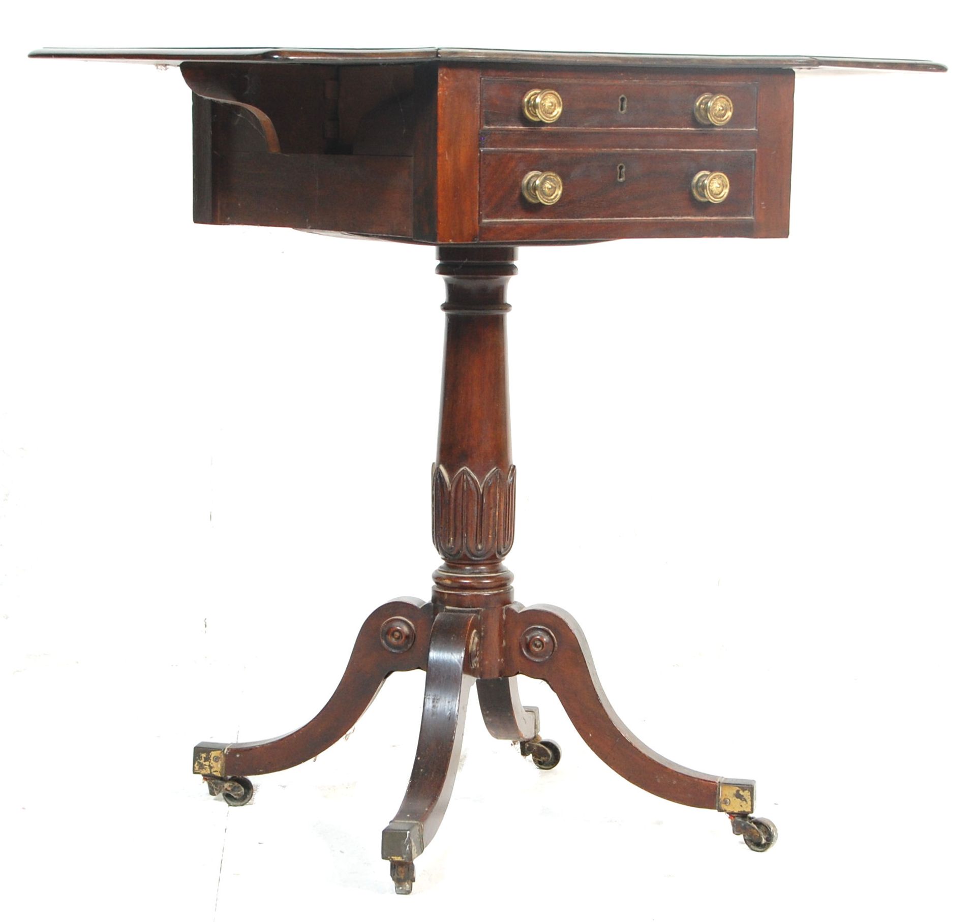 A 19th century George III mahogany drop leaf ladies tripod workbox table. The table raised on a