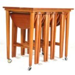 A retro vintage mid 20th century teak nest of tables in the style of Carlo Jensen. The nest