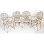 A set of four style 20th century French Fauteuil dining chairs / carver armchairs. Each with hand
