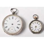 Two antique silver pocket watches to include one having engine turned decoration with a cartouche