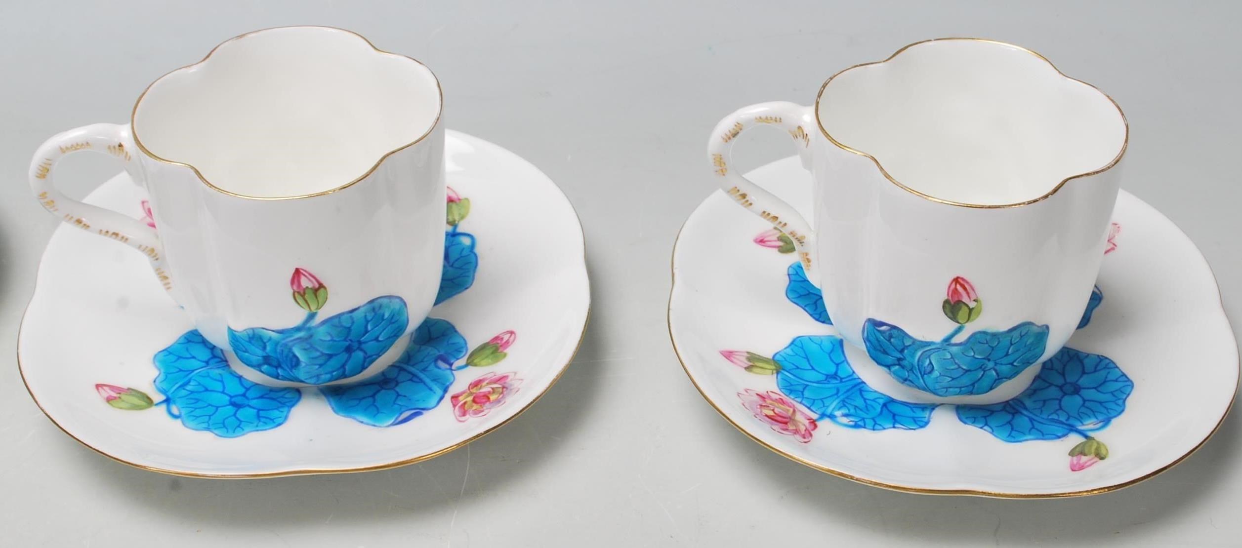 A 19th Century Victorian Coalport china tea set comprising of four trios and one cake plate with - Image 6 of 7