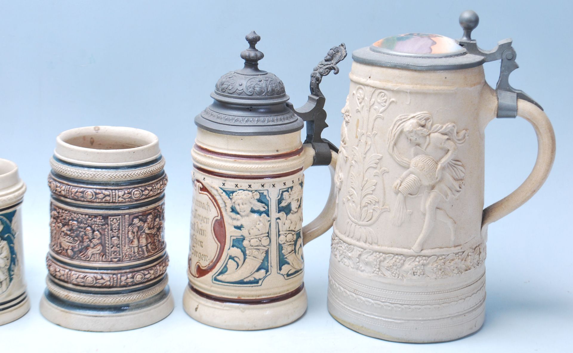 A large collection of German blue and grey stoneware jugs and beer steins, some having pewter - Image 9 of 11