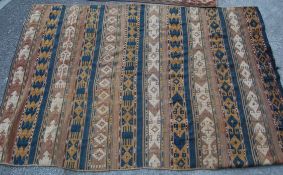 A pair of early 20th Century early south american tribal hand woven carpets / rugs having