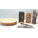 A collection of vintage African tribal artefacts to include a pair of tribal spearheads, an ebony
