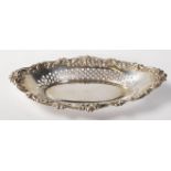A silver hallmarked pin tray with pierced decoration and floral swag border. Hallmarked for