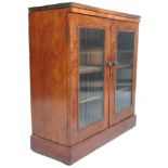 A 19th Century Victorian mahogany pier cabinet / bookcase with a ribbed glass double door having a