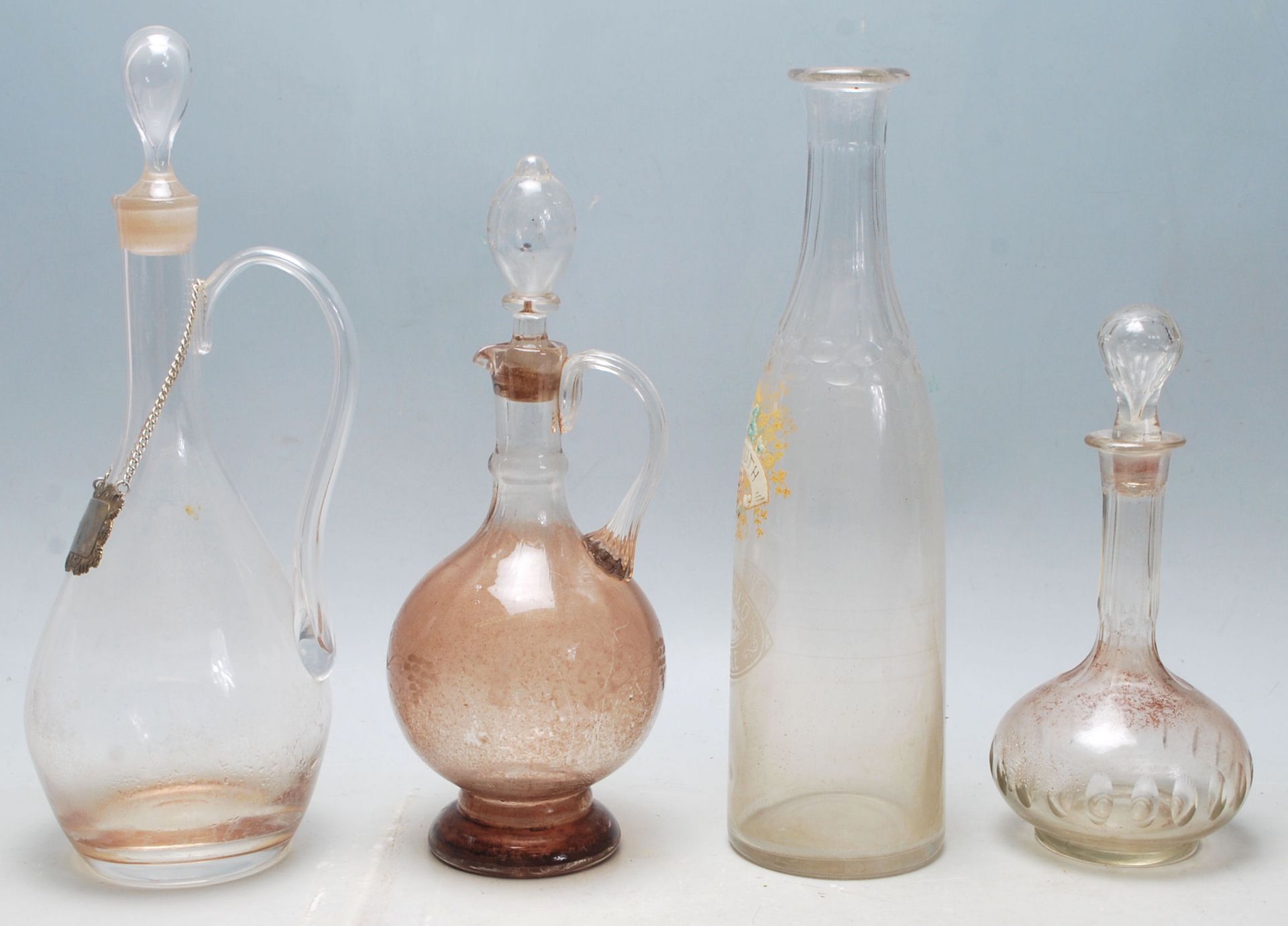 A collection of 18th century and 19th century Victorian glass decanters to include a two jug - Image 4 of 5