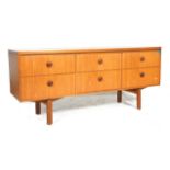 A retro vintage mid 20th Century teak danish influenced  cresenza sideboard. Of low and wide form