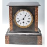 An Antique 20th Century Marble slate mantel clock having a flared top over a white enamel face and