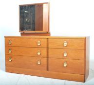 A good retro vintage 20th Century teak wood dressing table with six graduated drawers with brass