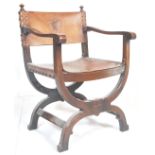 An early 20th Century Italian Tuscan Savonarola oak and leather  framed armchair. The oak frame
