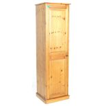 A 20th Century contemporary country pine tall sentry box wardrobe having a single panelled door with