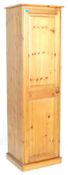 A 20th Century contemporary country pine tall sentry box wardrobe having a single panelled door with